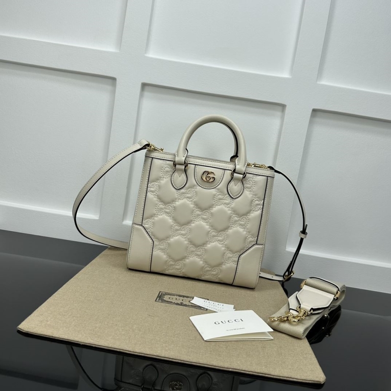 G*u*i top handle bags